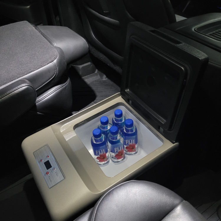 Cadillac Escalade ESV center console with bottled water and rear entertainment screen
