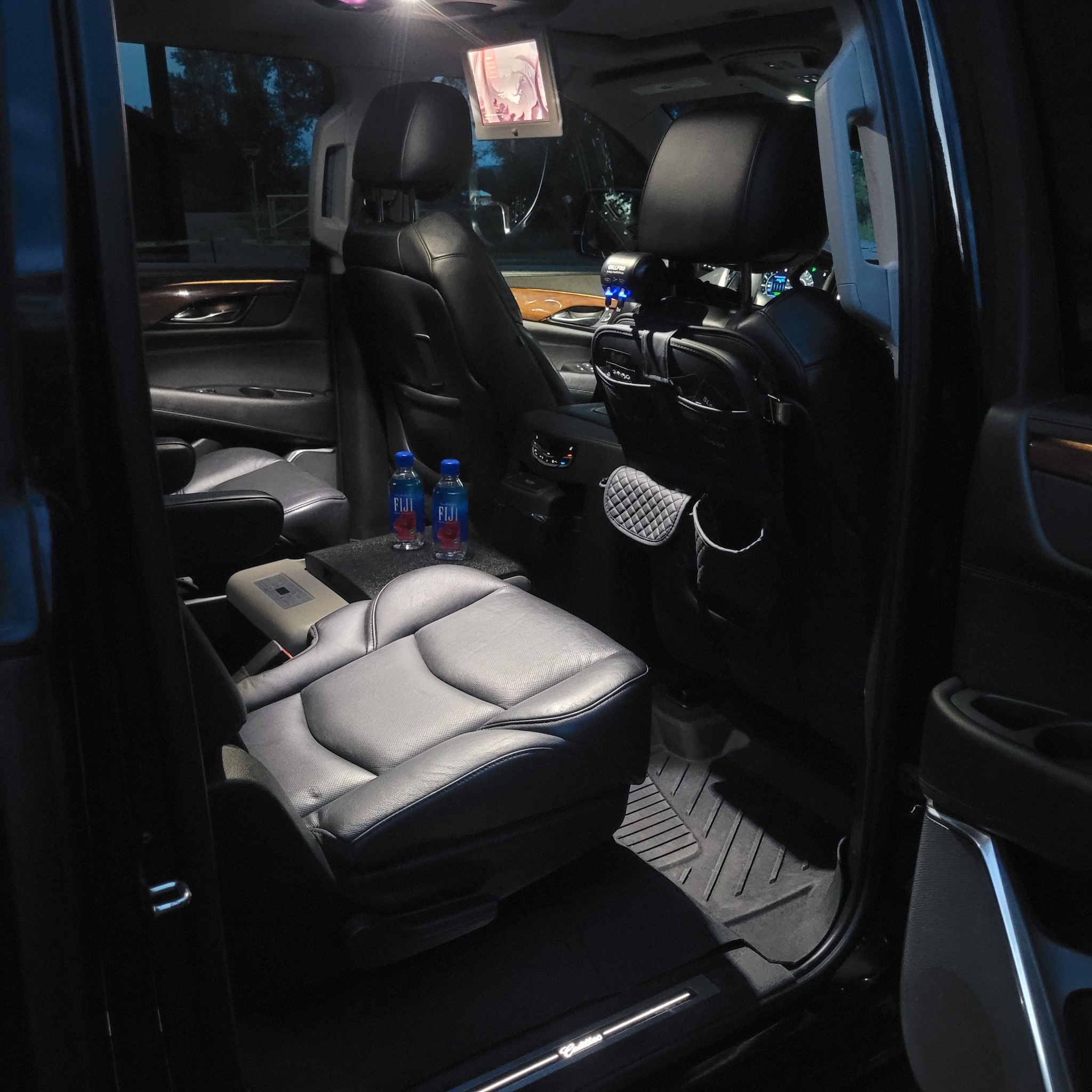 Cadillac Escalade luxury interior with captain chairs, premium leather seating and passenger amenities